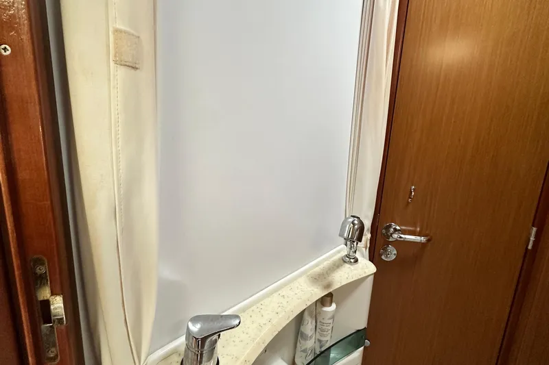  Yacht Photos Pics Interior of 2007 Jeanneau Sun Odyssey 42 DS yacht bathroom with sink and shower.