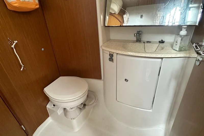  Yacht Photos Pics Bathroom interior of 2007 Jeanneau Sun Odyssey 42 DS yacht, featuring toilet and sink.