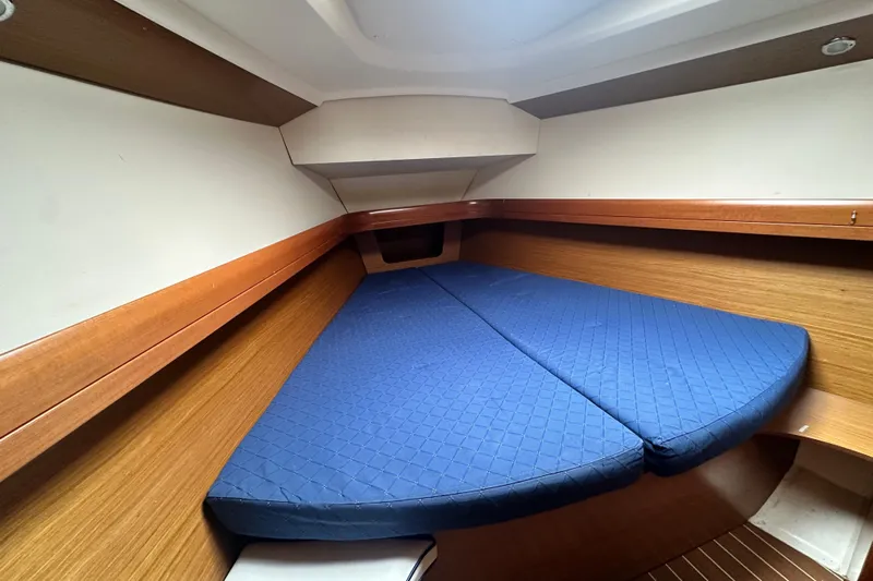 Yacht Photos Pics Interior cabin of 2007 Jeanneau Sun Odyssey 42 DS with blue mattress.