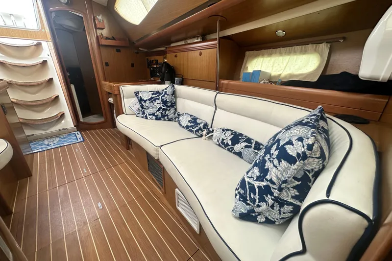  Yacht Photos Pics Interior of 2007 Jeanneau Sun Odyssey 42 DS with elegant seating and nautical decor.