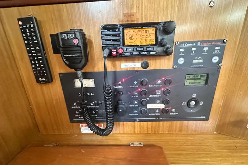 Yacht Photos Pics Control panel of a 2007 Jeanneau Sun Odyssey 42 DS sailboat with radio and remote.