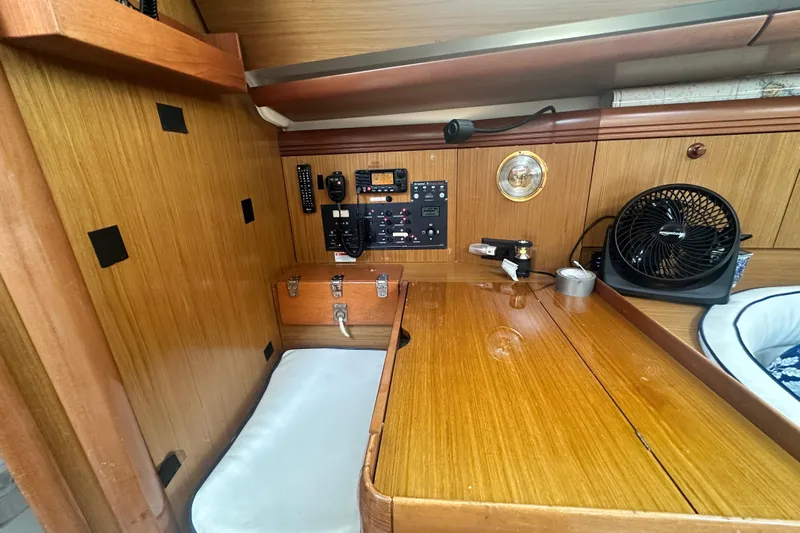  Yacht Photos Pics 2007 Jeanneau Sun Odyssey 42 DS interior with navigation station and wooden finish.