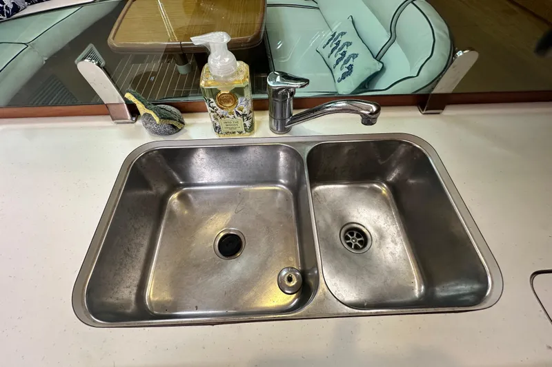  Yacht Photos Pics Stainless steel sink in 2007 Jeanneau Sun Odyssey 42 DS yacht kitchen.