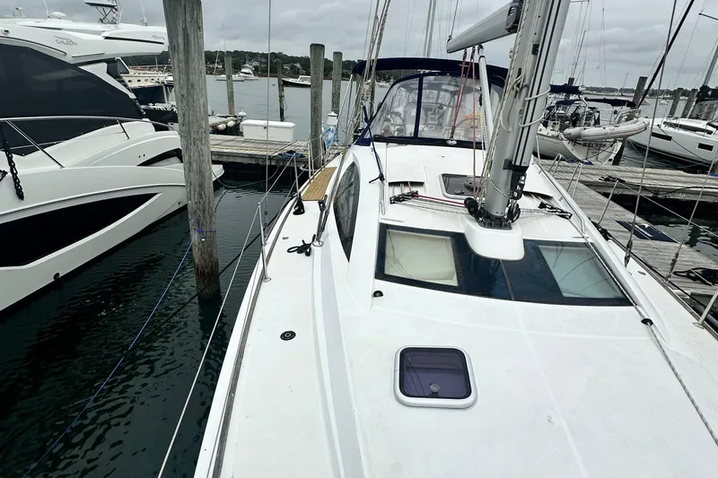  Yacht Photos Pics 2007 Jeanneau Sun Odyssey 42 DS sailboat docked at marina, overcast sky.