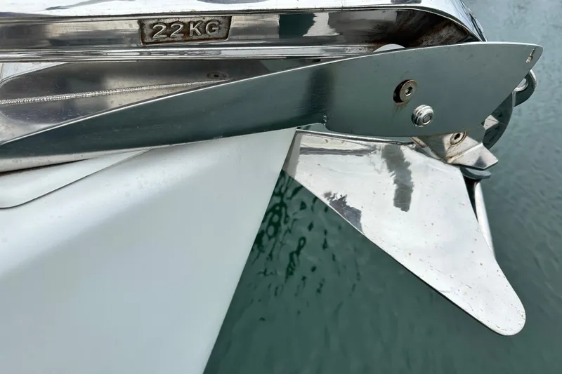  Yacht Photos Pics Close-up of Jeanneau Sun Odyssey 42 DS anchor, 22kg, 2007 model, over water.