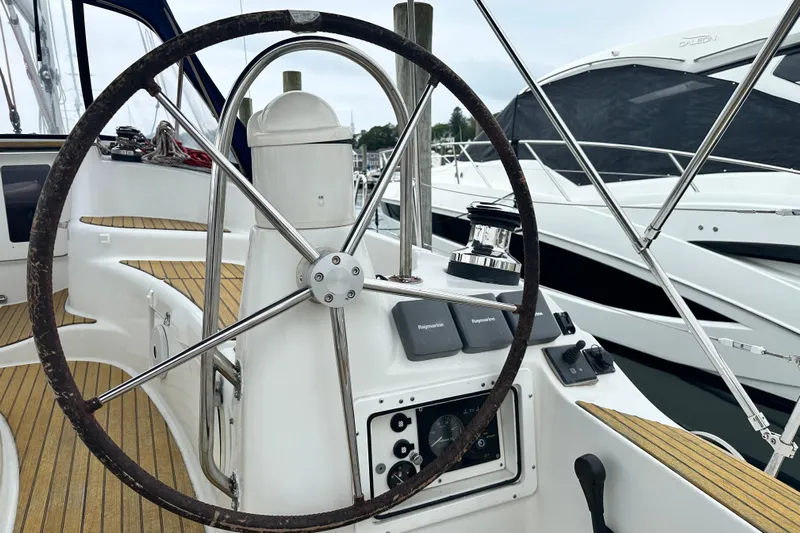  Yacht Photos Pics Steering wheel of 2007 Jeanneau Sun Odyssey 42 DS sailboat, docked at marina.