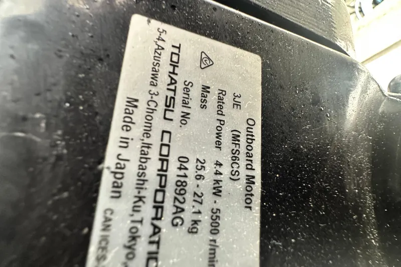  Yacht Photos Pics Label on Tohatsu outboard motor, 4.4 kW, serial 041892AG, made in Japan.