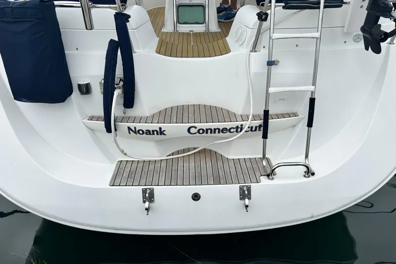  Yacht Photos Pics 2007 Jeanneau Sun Odyssey 42 DS sailboat stern, Noank, Connecticut, with ladder and teak deck.