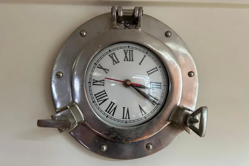 Eagle Yacht Photos Pics Nautical-themed clock with Roman numerals on a Mainship Pilot 34, 2008 model.