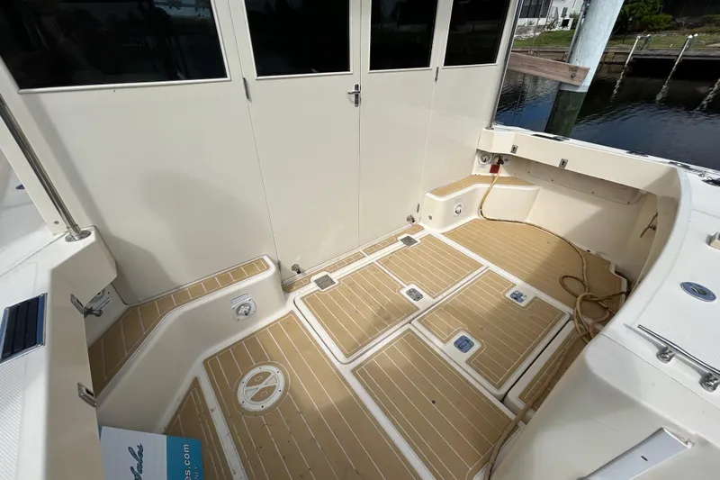 Eagle Yacht Photos Pics 2008 Mainship Pilot 34 boat deck with teak flooring and storage compartments.