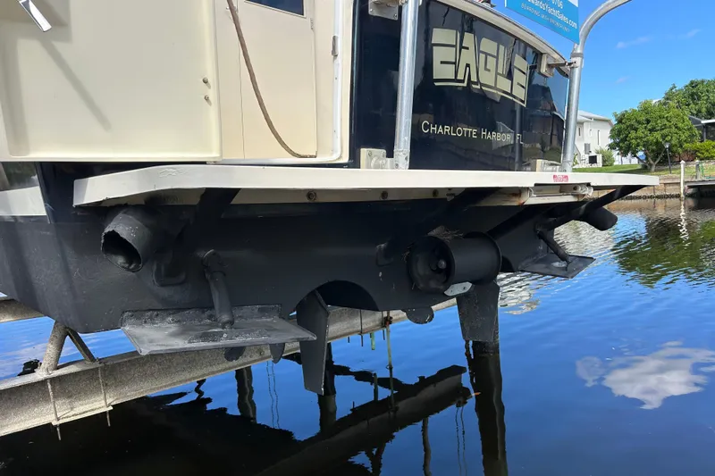 Eagle Yacht Photos Pics 2008 Mainship Pilot 34 boat stern view at Charlotte Harbor, Florida, on a lift.