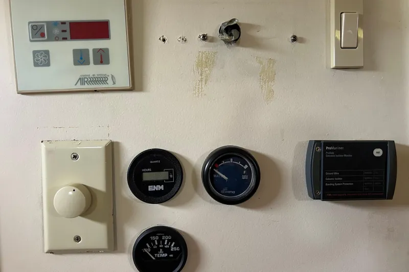 Eagle Yacht Photos Pics Control panel of a 2008 Mainship Pilot 34 boat with various gauges and switches.