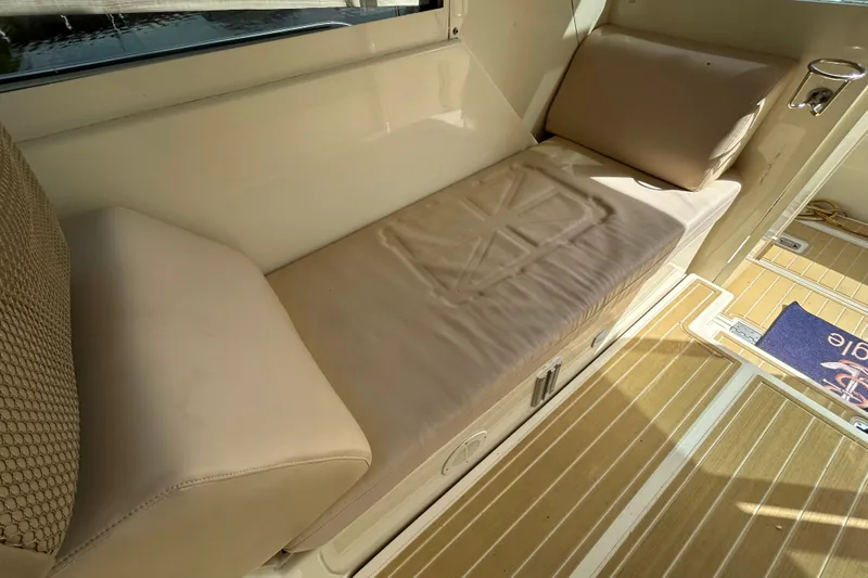 Eagle Yacht Photos Pics 2008 Mainship Pilot 34 interior with beige seating and wooden flooring.