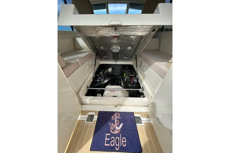 Eagle Yacht Photos Pics 2008 Mainship Pilot 34 engine compartment with open hatch and "Eagle" mat.