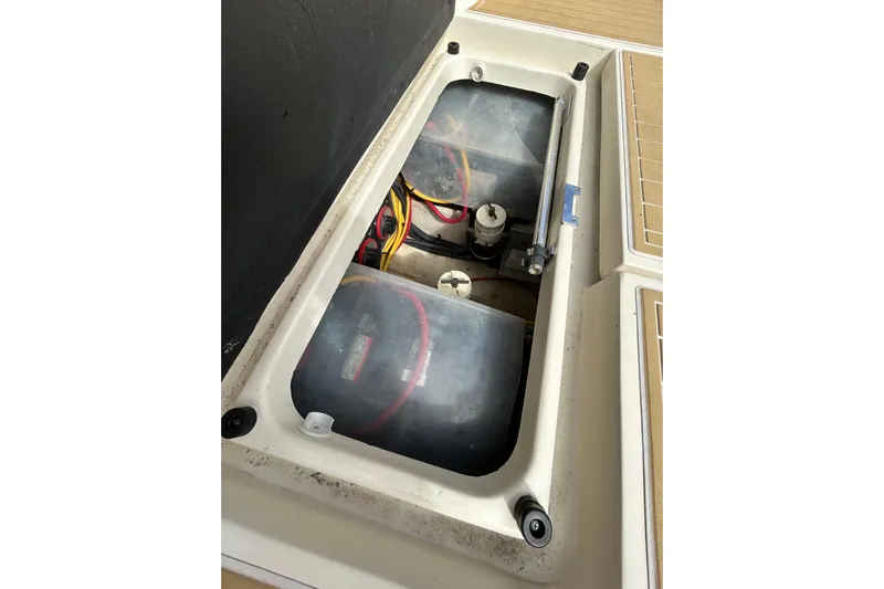 Eagle Yacht Photos Pics Battery compartment of a 2008 Mainship Pilot 34 boat, showing wiring and components.