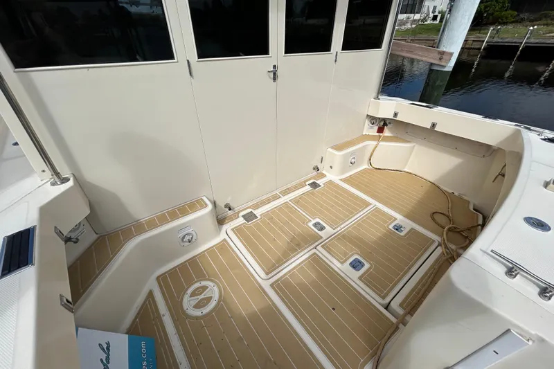 Eagle Yacht Photos Pics 2008 Mainship Pilot 34 boat deck with teak flooring and storage compartments.