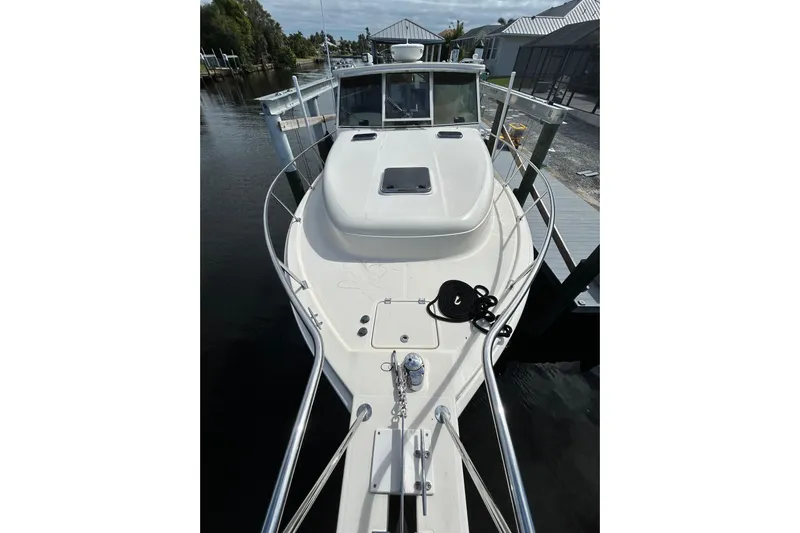 Eagle Yacht Photos Pics 2008 Mainship Pilot 34 boat docked, showcasing sleek design and spacious deck.