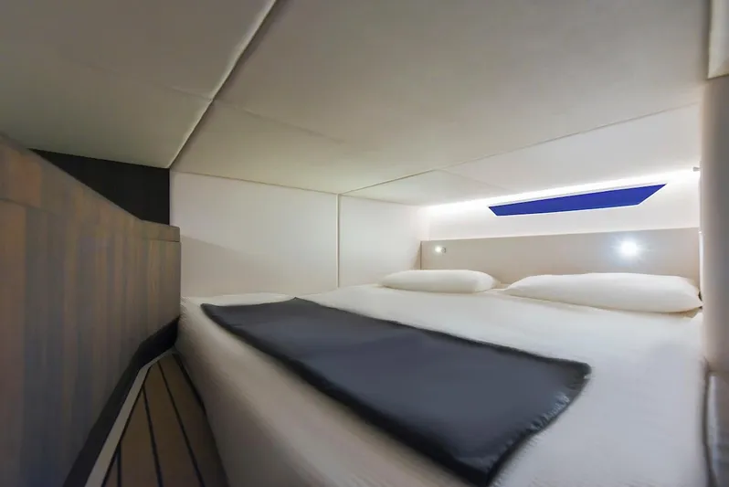 Build To Order Yacht Photos Pics Luxurious cabin interior of 2024 Oryx 379 yacht with modern bedding and ambient lighting.