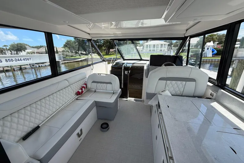 American Rebel Yacht Photos Pics Luxurious interior of 2025 Regal 36 XO yacht with elegant seating and modern design.