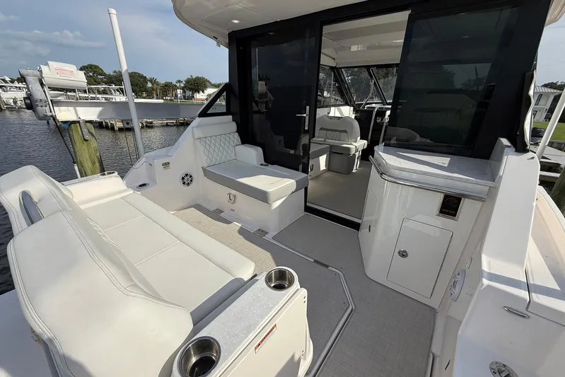 American Rebel Yacht Photos Pics 2025 Regal 36 XO boat interior with seating and modern amenities.