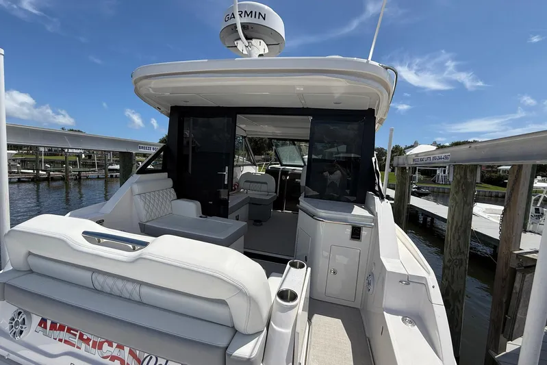 American Rebel Yacht Photos Pics 2025 Regal 36 XO luxury yacht interior with seating and navigation equipment.