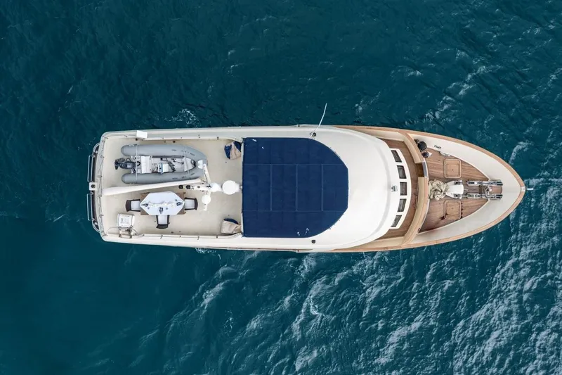 Seabear Yacht Photos Pics Aerial view of 2006 Amanda 72 Explorer yacht on blue ocean water.