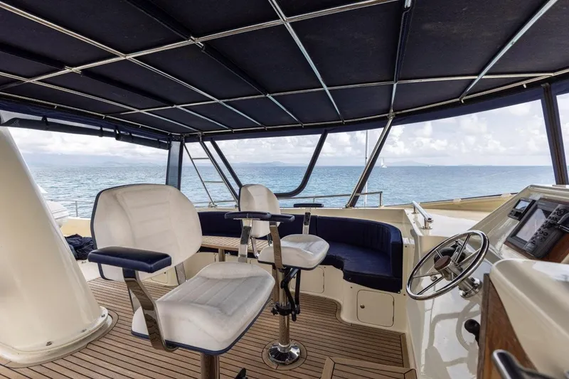 Seabear Yacht Photos Pics Interior view of 2006 Amanda 72 Explorer yacht with ocean backdrop.