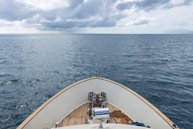 Seabear Yacht Photos Pics Bow of 2006 Amanda 72 Explorer yacht navigating open sea under cloudy sky.