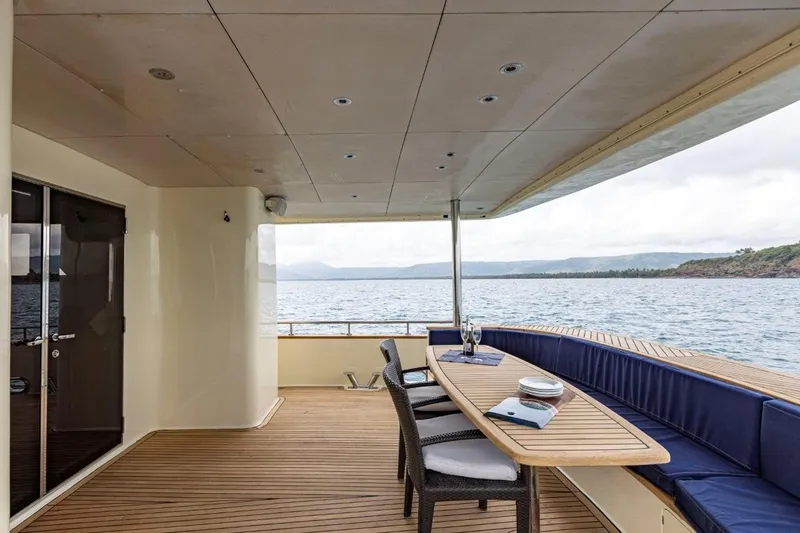 Seabear Yacht Photos Pics Luxurious deck of 2006 Amanda 72 Explorer yacht with ocean view and dining area.