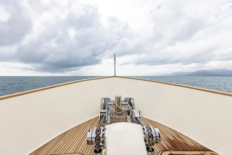 Seabear Yacht Photos Pics Bow view of 2006 Amanda 72 Explorer yacht on open sea under cloudy sky.
