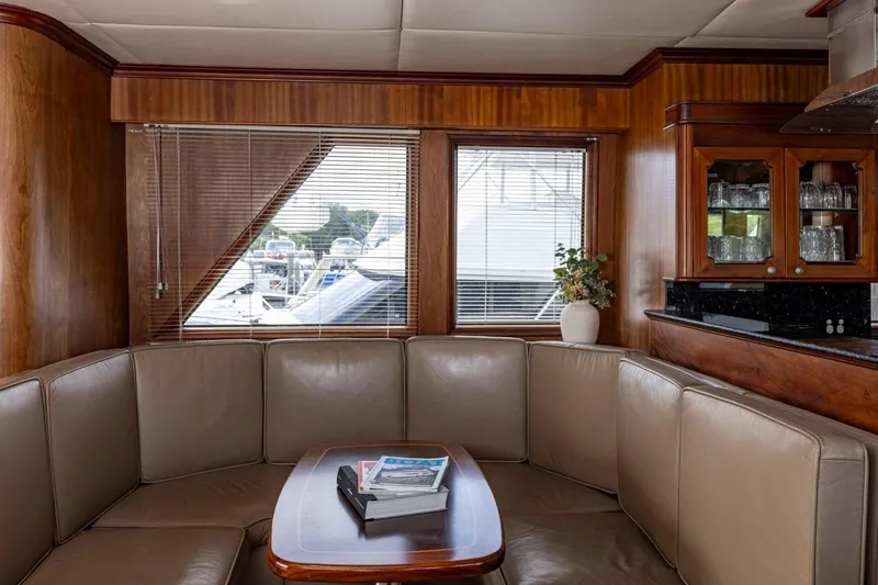 Seabear Yacht Photos Pics Luxurious interior of 2006 Amanda 72 Explorer yacht with leather seating and wooden accents.
