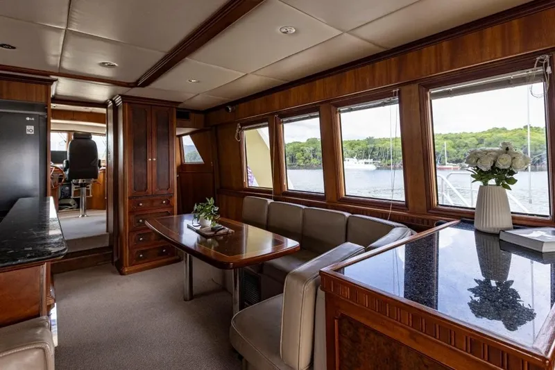 Seabear Yacht Photos Pics Luxurious interior of 2006 Amanda 72 Explorer yacht with elegant wood finishes and scenic windows.