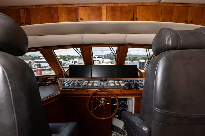 Seabear Yacht Photos Pics Interior of 2006 Amanda 72 Explorer yacht cockpit with control panel and leather seats.