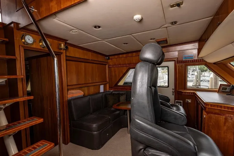 Seabear Yacht Photos Pics Luxurious interior of 2006 Amanda 72 Explorer yacht with leather seating and wooden accents.