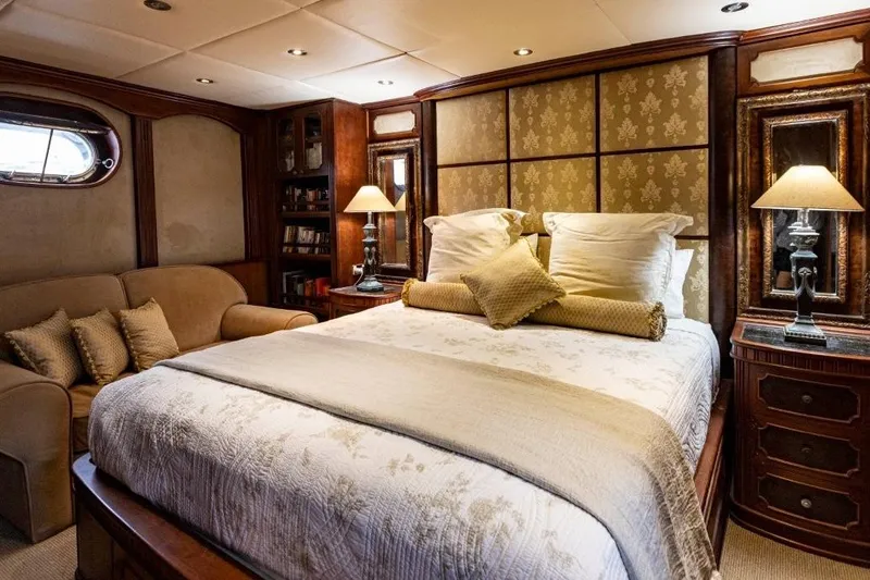 Seabear Yacht Photos Pics Luxurious bedroom interior on 2006 Amanda 72 Explorer yacht, featuring elegant decor and cozy ambiance.