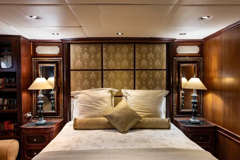 Seabear Yacht Photos Pics Luxurious bedroom interior in 2006 Amanda 72 Explorer yacht with elegant wood paneling.