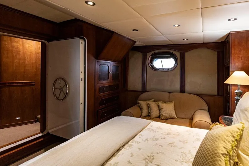 Seabear Yacht Photos Pics Luxurious cabin interior of 2006 Amanda 72 Explorer yacht with cozy seating and elegant decor.