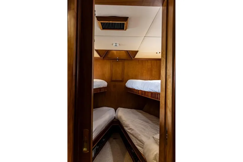 Seabear Yacht Photos Pics Cozy wooden cabin with bunk beds in 2006 Amanda 72 Explorer yacht.