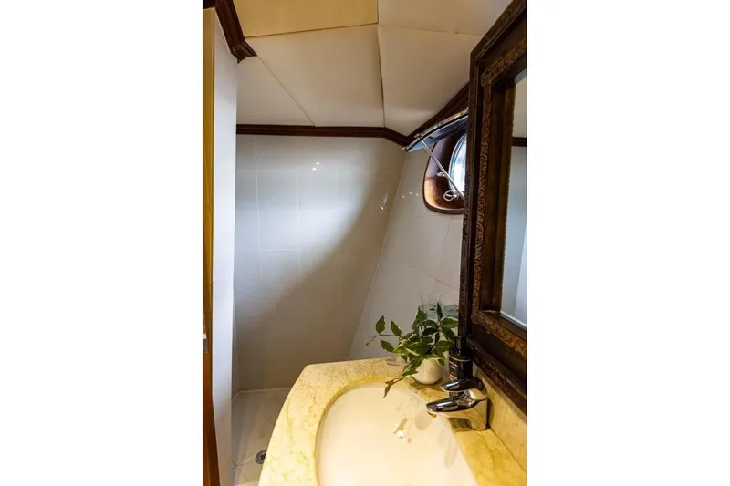 Seabear Yacht Photos Pics Luxurious bathroom interior on 2006 Amanda 72 Explorer yacht, featuring elegant sink and mirror.