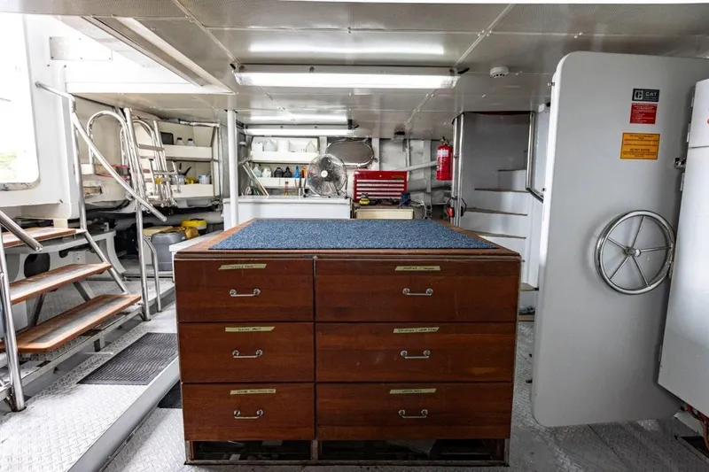 Seabear Yacht Photos Pics Interior of 2006 Amanda 72 Explorer yacht with wooden drawers and metal stairs.