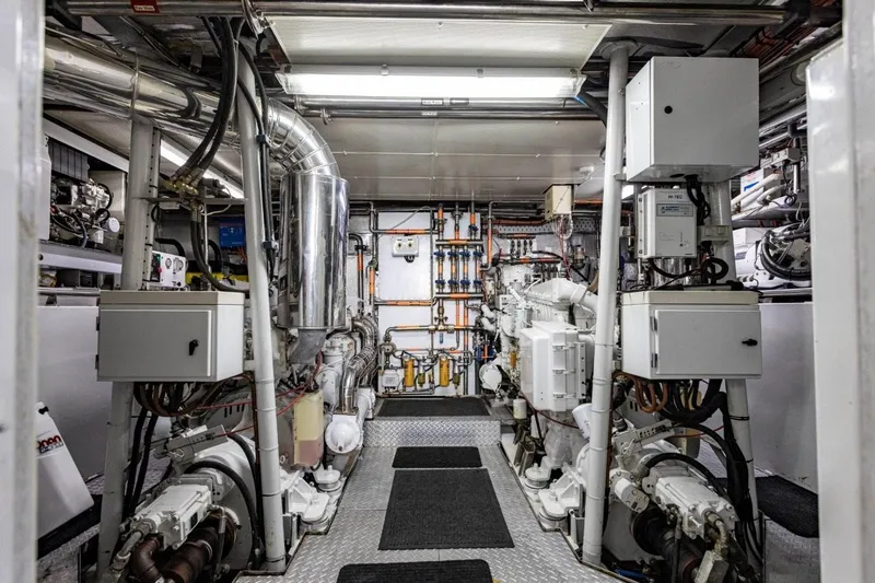 Seabear Yacht Photos Pics Engine room of 2006 Amanda 72 Explorer yacht, featuring complex machinery and control panels.