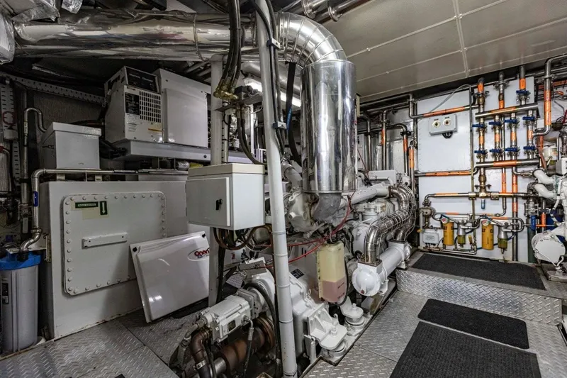 Seabear Yacht Photos Pics Engine room of a 2006 Amanda 72 Explorer yacht, featuring complex machinery and piping.