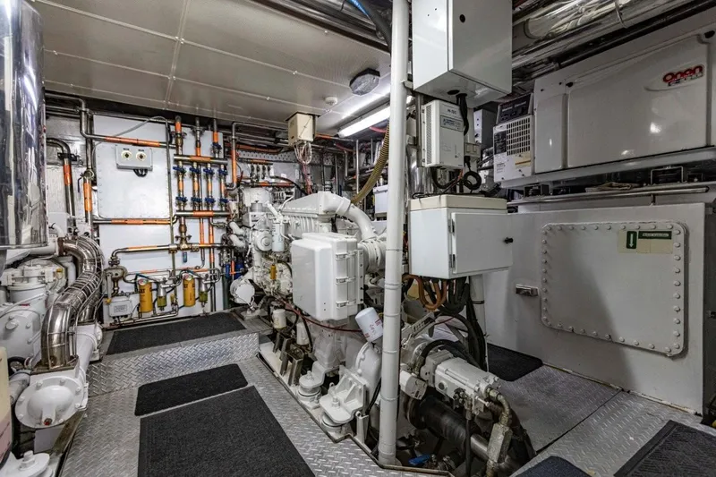 Seabear Yacht Photos Pics Engine room of a 2006 Amanda 72 Explorer yacht, featuring complex machinery and piping.