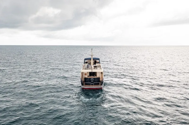 Seabear Yacht Photos Pics A 2006 Amanda 72 Explorer yacht navigating open sea under cloudy skies.