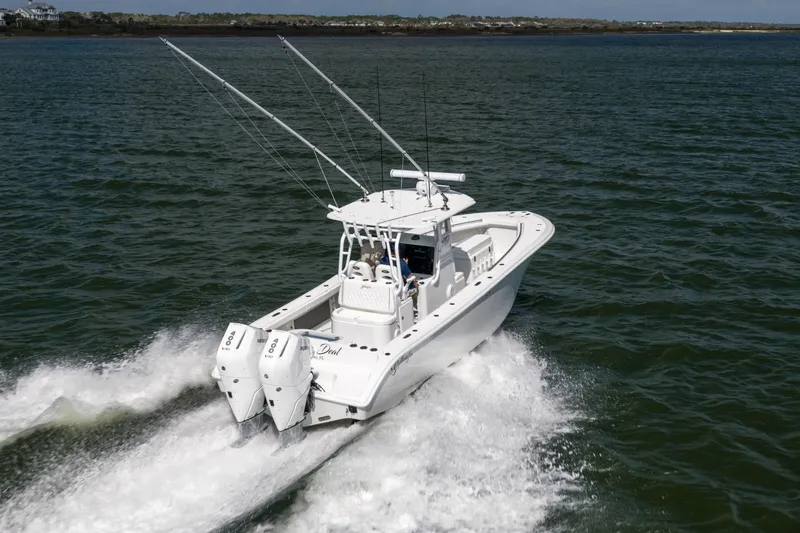 Done Deal Yacht Photos Pics 2014 Yellowfin 32 Offshore boat cruising on open water with dual engines.