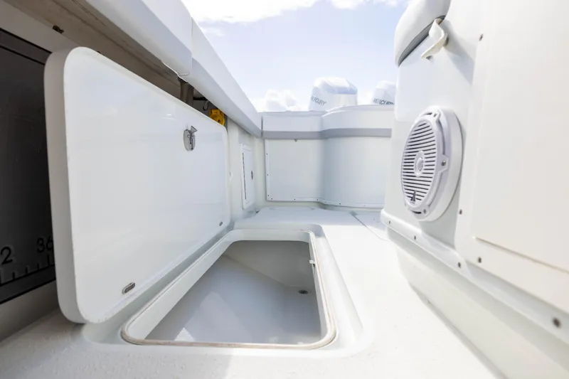 Done Deal Yacht Photos Pics 2014 Yellowfin 32 Offshore boat storage compartments and speaker detail.