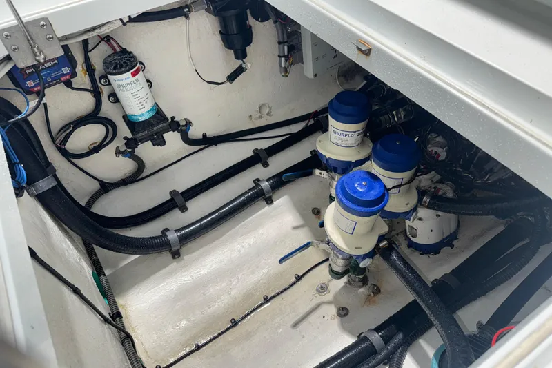 Done Deal Yacht Photos Pics Engine compartment of a 2014 Yellowfin 32 Offshore boat, featuring Shurflo pumps and wiring.