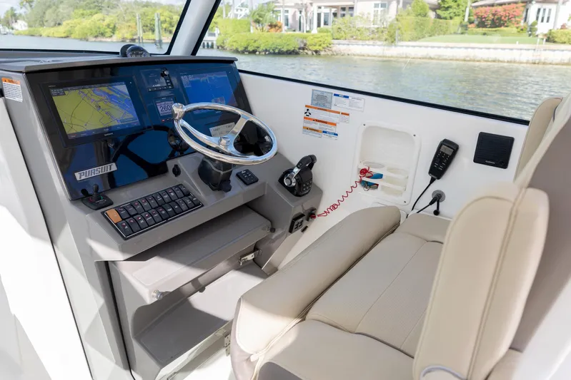 Joysea Yacht Photos Pics 2019 Pursuit DC 325 Dual Console helm with navigation screens and comfortable seating.