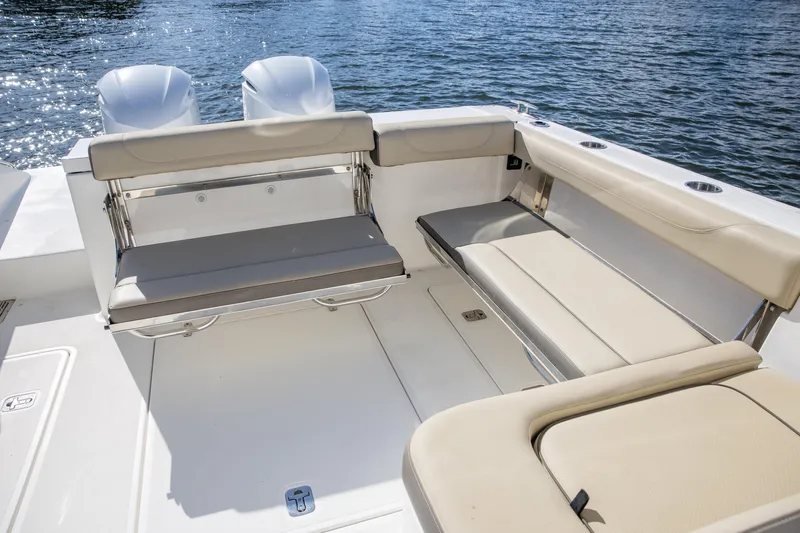 Joysea Yacht Photos Pics 2019 Pursuit DC 325 Dual Console boat interior with beige seating and twin engines.