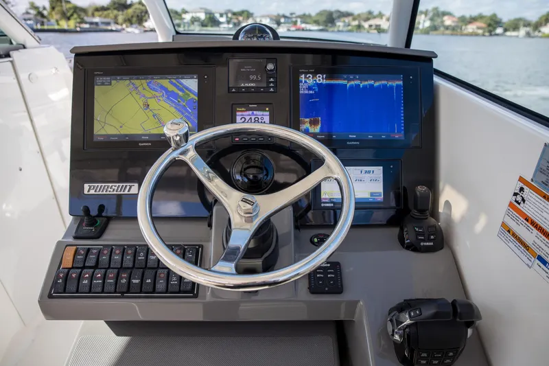 Joysea Yacht Photos Pics 2019 Pursuit DC 325 Dual Console dashboard with navigation and control systems.